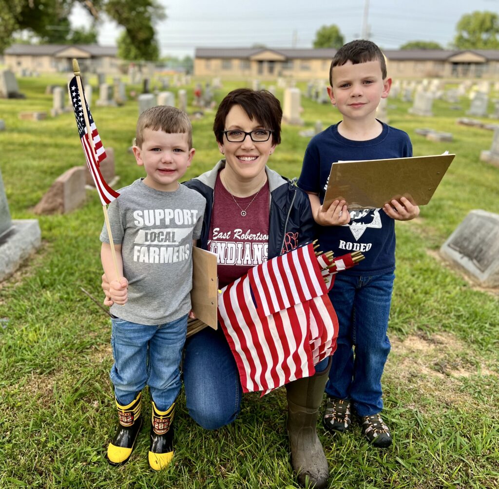 Placing flags on the gravesites or our Veterans on Memorial Day weekend