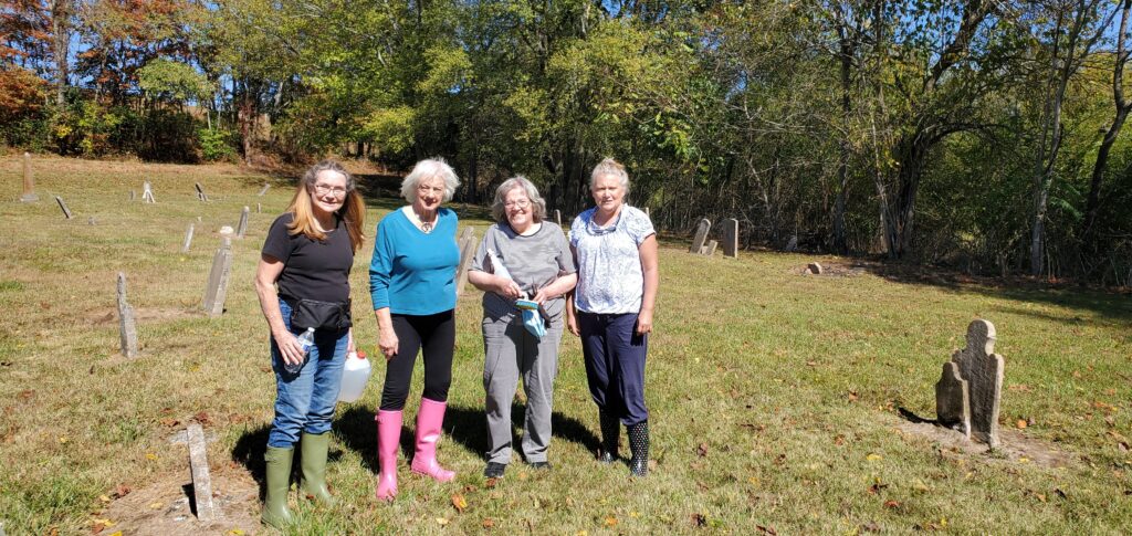 Chapter members cleaning headstones